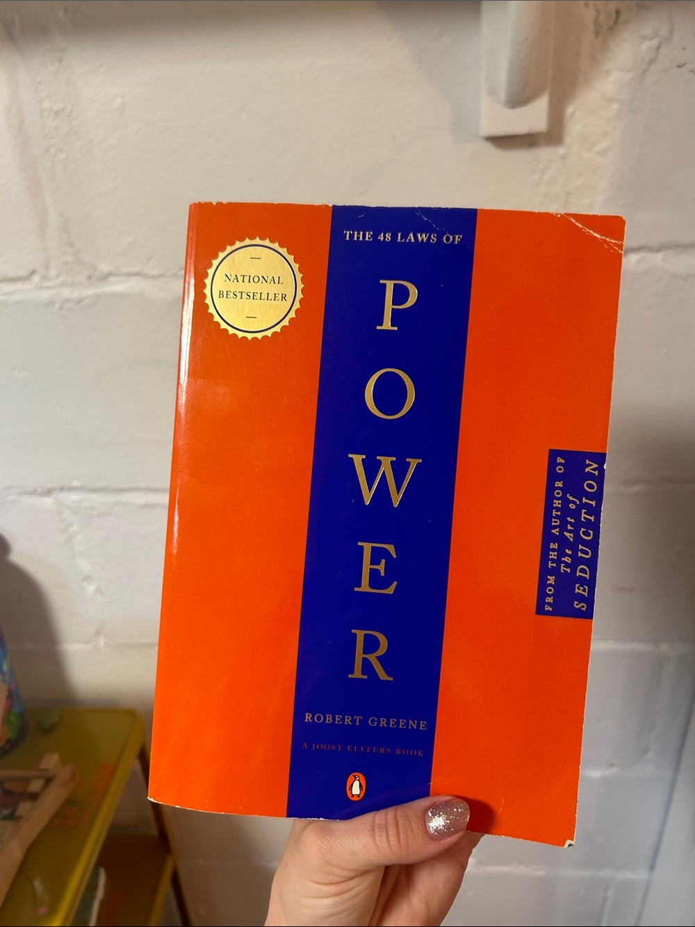 The 48 Laws of Power by Robert Greene - Orange & Blue Paperback